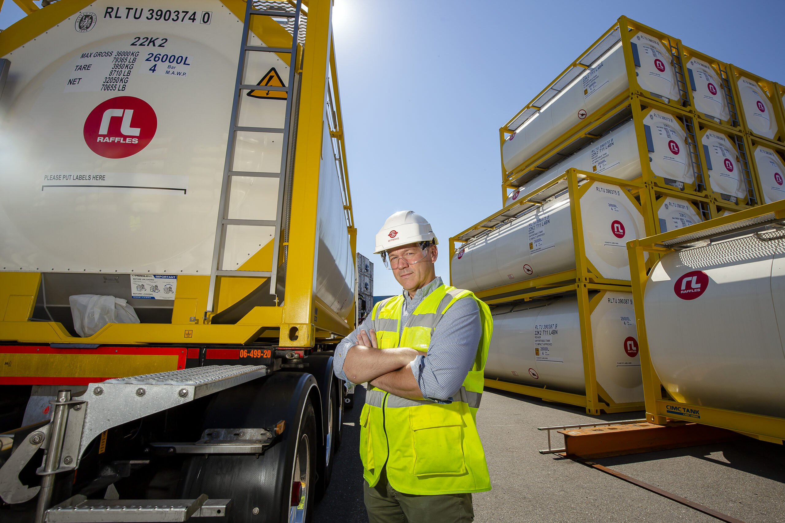 newsletter - standing man with tank container - raffles lease